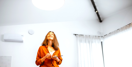 Lady looking at a ceiling light