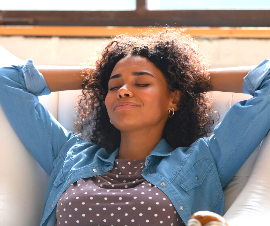 A woman relaxing on the couch