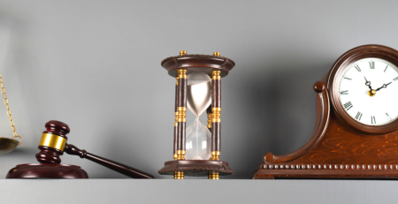 Gavel, hourglass and clock