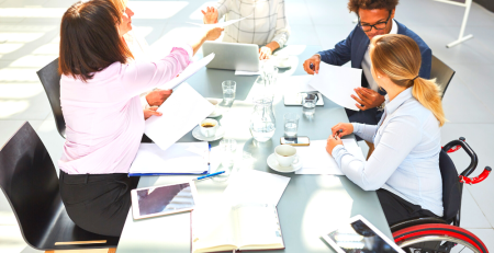 People sitting around a table, planning