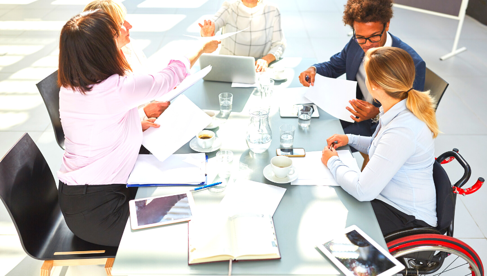 People sitting around a table, planning