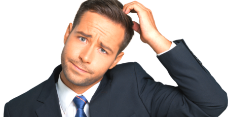 A confused looking man in a suit scratching his head