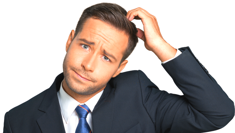 A confused looking man in a suit scratching his head