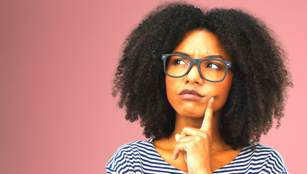 A young African woman wondering