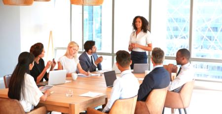 A group of people around a boardroom table.