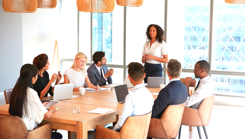 A group of people around a boardroom table.